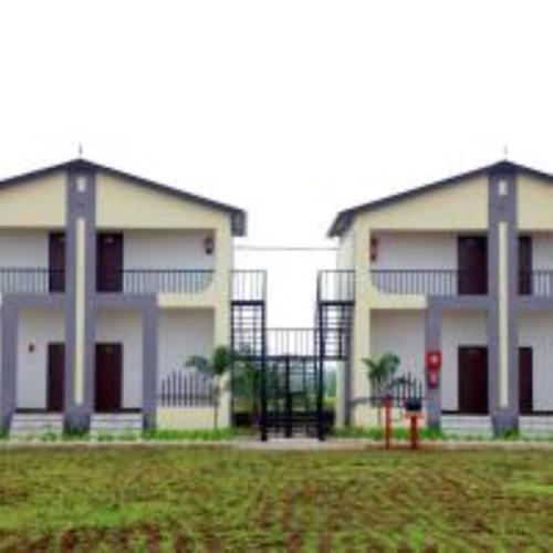 a apartment building with a playground in front of it at VITS Select Diamond Resort Sasan Gir in Talala