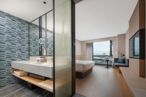 TV a/nebo společenská místnost v ubytování Fairfield by Marriott Yiwu