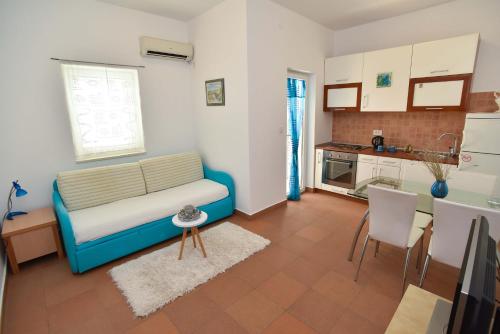 Η κουζίνα ή μικρή κουζίνα στο Blue Mare Apartment