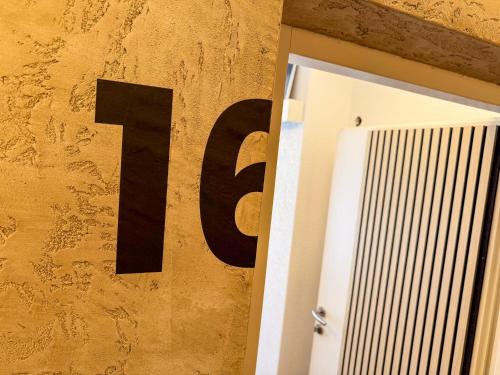 a sign on a wall with the number ten next to a door at Luna Studios Zillertal in Hippach