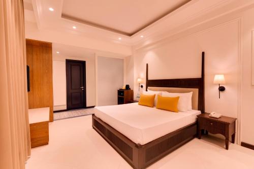 Lemon Tree Hotel, Arpora, Goaにあるベッド