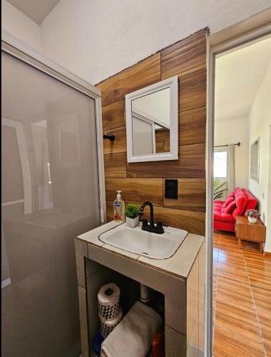 a bathroom with a sink and a shower at Sunset in Sayulita