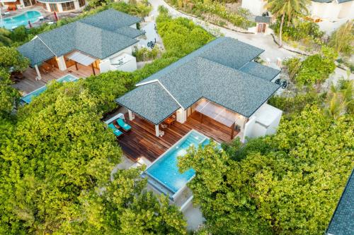 an aerial view of a house with a swimming pool at Hideaway Beach Resort & Spa, FREE SHARED CHARTER FLIGHT for two on stays of 7 or more nights from September 2025 until 23rd December 2026 in Dhidhdhoo