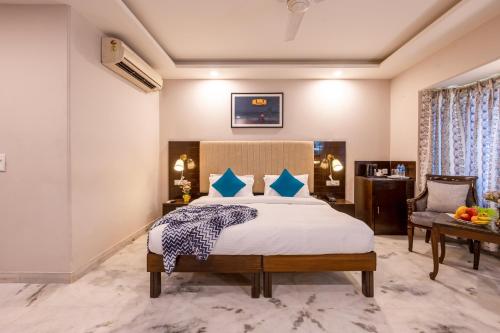 a bedroom with a bed and a desk and a chair at Tribe - Bespoke Hotel by FlxHo Arjun Marg DLF Phase 1 Golf Course Road in Gurgaon