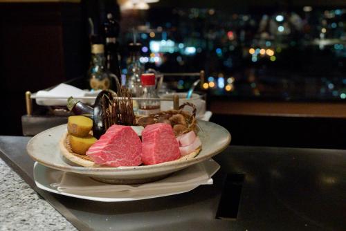 a plate of food on top of a counter at Premier Hotel Nakajima Park Sapporo in Sapporo