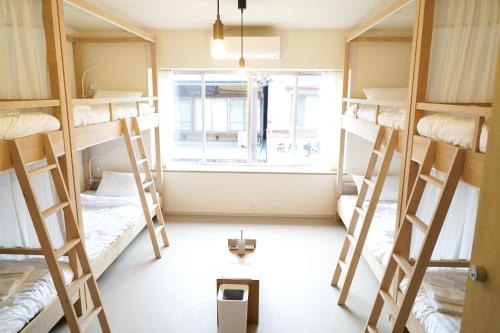 Postel nebo postele na pokoji v ubytování EdoHouse -エドゥハウス-