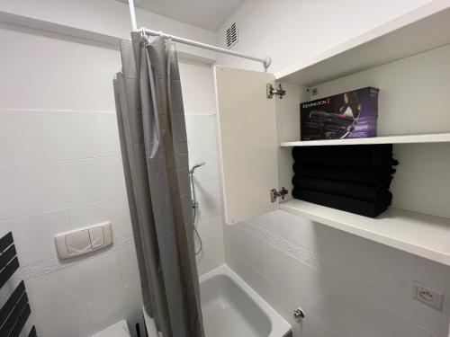a bathroom with a shower and a sink at Home4you Katowice in Katowice