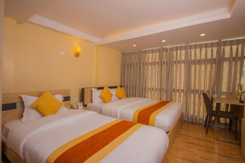 Postel nebo postele na pokoji v ubytování OYO 262 Hotel Kumari