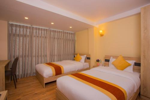 Postel nebo postele na pokoji v ubytování OYO 262 Hotel Kumari