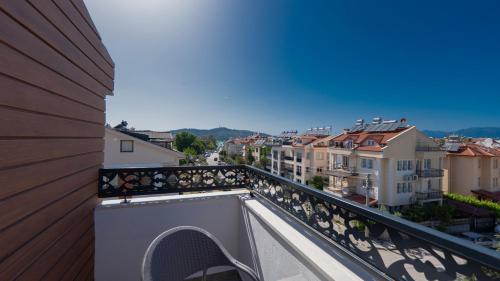 a balcony with a view of a city at Mucize Residence in Fethiye