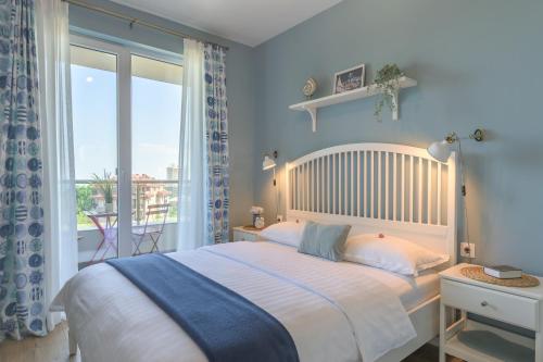 Postel nebo postele na pokoji v ubytování Apartment BLUE LAGOON