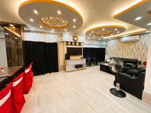 a living room with a couch and a stage at Hotel Anurag Palace In Agartala in Agartala