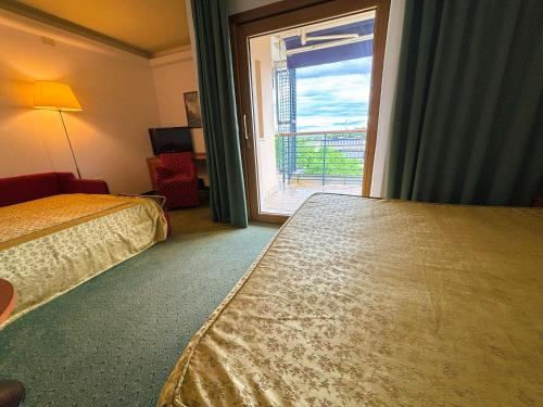 Postel nebo postele na pokoji v ubytování Hotel Rialto