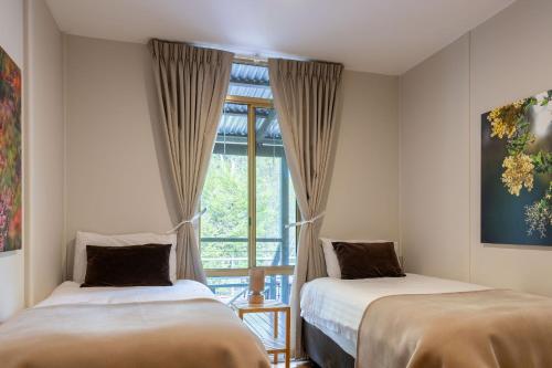 Ένα ή περισσότερα κρεβάτια σε δωμάτιο στο River Bend Retreat I Private Properties