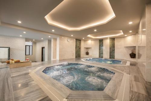 a large bathroom with a large tub in the middle at HTOWER - 197 Văn Cao, Gia Viên, Hải Phòng in Hai Phong