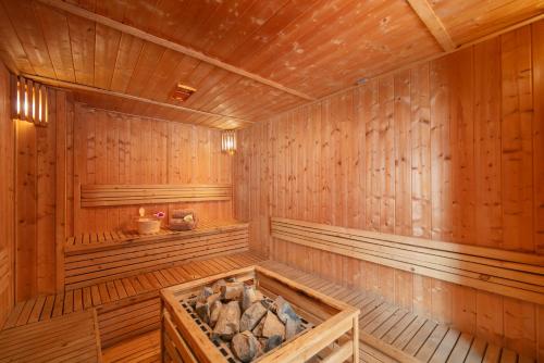 a wooden sauna with a large wooden tub at HTOWER - 197 Văn Cao, Gia Viên, Hải Phòng in Hai Phong