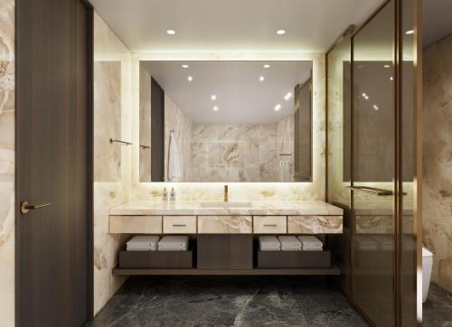 a bathroom with a sink and a shower at The Siena PRIMO in Seogwipo