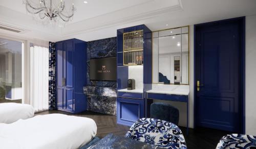 a bedroom with blue walls and a bathroom with a sink at The Siena PRIMO in Seogwipo