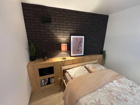 Postel nebo postele na pokoji v ubytování L'ecrin d'Alsace