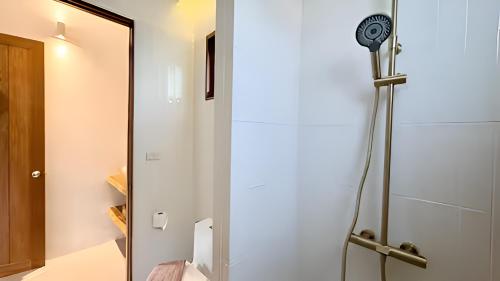 a shower in a bathroom next to a door at Villa La Golden Monkey, Villa 24 in Chaweng Noi Beach