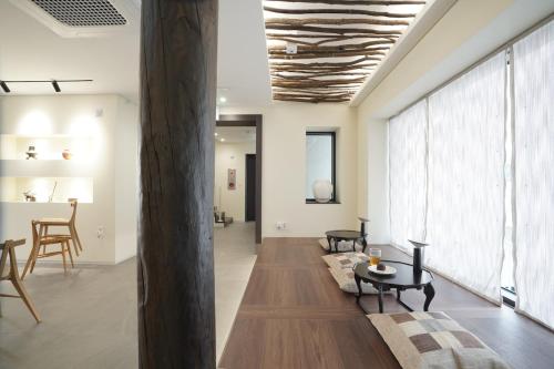 a living room with a couch and a table at Boro Hanok Hostel in Myeongdong in Seoul