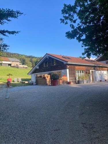 a house with a driveway in front of it at Ô songes de Saxel in Saxel