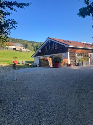 a house with a driveway in front of it at Ô songes de Saxel in Saxel