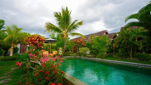 Kolam renang di atau dekat dengan Green Coconut Cottage