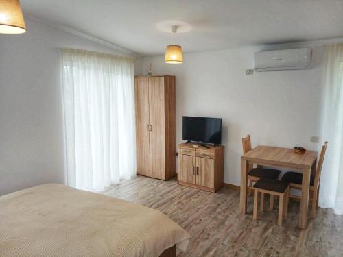 TV a/nebo společenská místnost v ubytování Greci GuestHouse