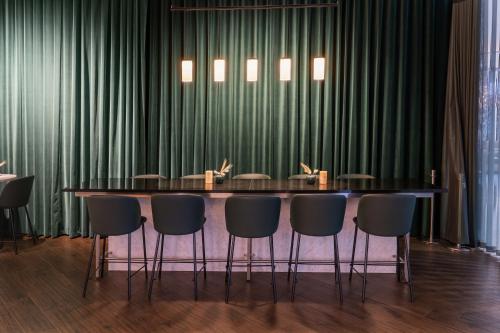 a conference room with a long table and chairs at Gothia Towers & Upper House in Gothenburg
