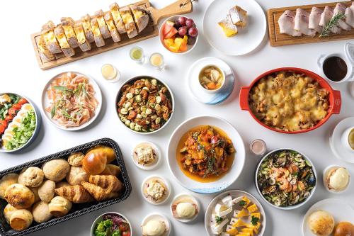 a table filled with different dishes of food at Premier hotel -CABIN PRESIDENT- Tokyo in Tokyo