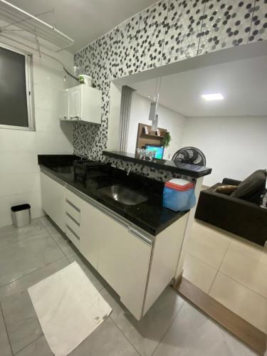 Η κουζίνα ή μικρή κουζίνα στο Apto aconchegante em contagem