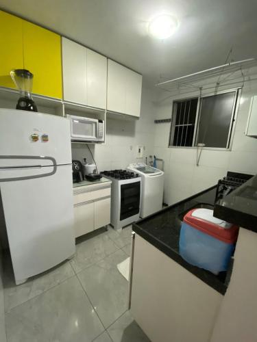 Η κουζίνα ή μικρή κουζίνα στο Apto aconchegante em contagem