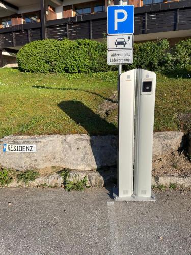 an old refrigerator sitting on the side of a street at Alpenresidenz Buchenhöhe in Berchtesgaden
