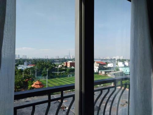 a view of a city from a window at Winston Hotel Riverside in Ho Chi Minh City
