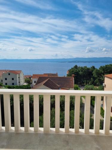 a view of the ocean from a white fence at Villa Mila in Bol