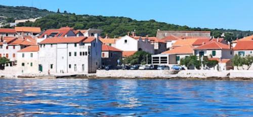 a view of a city from the water at Apartmani Banić Apartman 5 in Postira