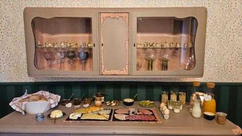 a table with glasses and other items on it at Villa Elbling in Radebeul
