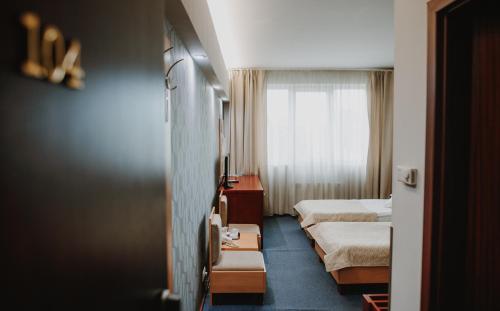Postel nebo postele na pokoji v ubytování Hotel Concrete