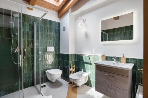 a bathroom with a toilet and a sink and a shower at Agriturismo Barone Antonio Negri in Fisciano