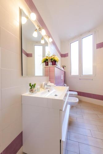 a bathroom with a white sink and a toilet at Il Timone in Santa Margherita Ligure