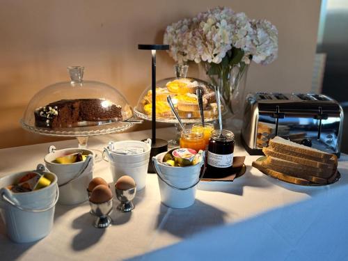 a table with a tray of food on a table at Albergo Tenco by Bottega in Alice Bel Colle
