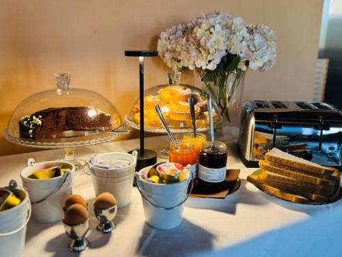 a table topped with a buffet of food and desserts at Albergo Tenco by Bottega in Alice Bel Colle