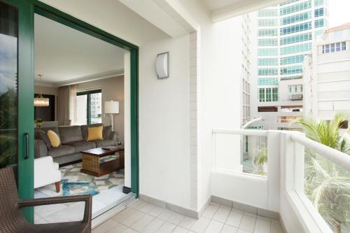 a balcony with a view of a living room at Condado Vanderbilt Hotel in San Juan