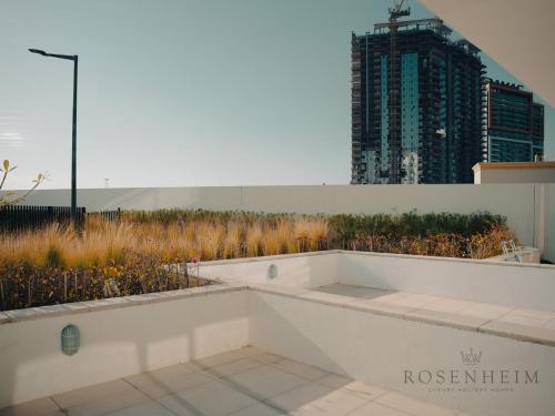 a bath tub sitting on the side of a building at Modern Studio Escape - Pool, Gym & Relaxation in Dubai