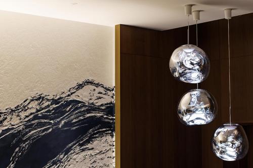 three glass lights hanging from a wall in a room at Premier hotel -CABIN PRESIDENT- Tokyo in Tokyo