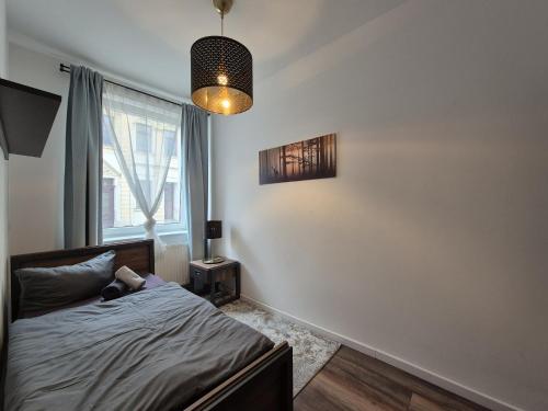 Postel nebo postele na pokoji v ubytování Mikra Homes24 in Crimmitschau