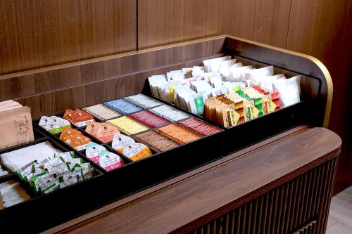 a display case filled with different types of food at Premier hotel -CABIN PRESIDENT- Tokyo in Tokyo