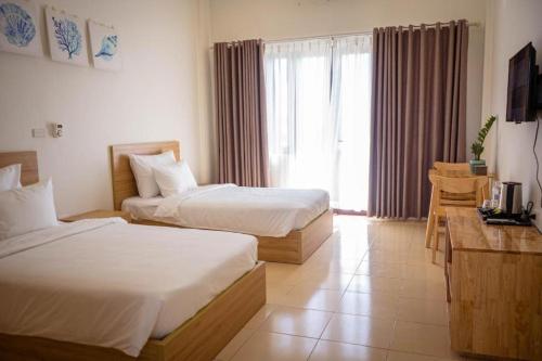 Ένα ή περισσότερα κρεβάτια σε δωμάτιο στο Farmer Community Hotel