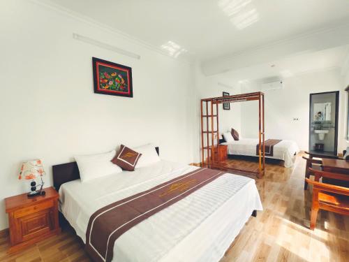 Ένα ή περισσότερα κρεβάτια σε δωμάτιο στο Homestay Tam Cốc